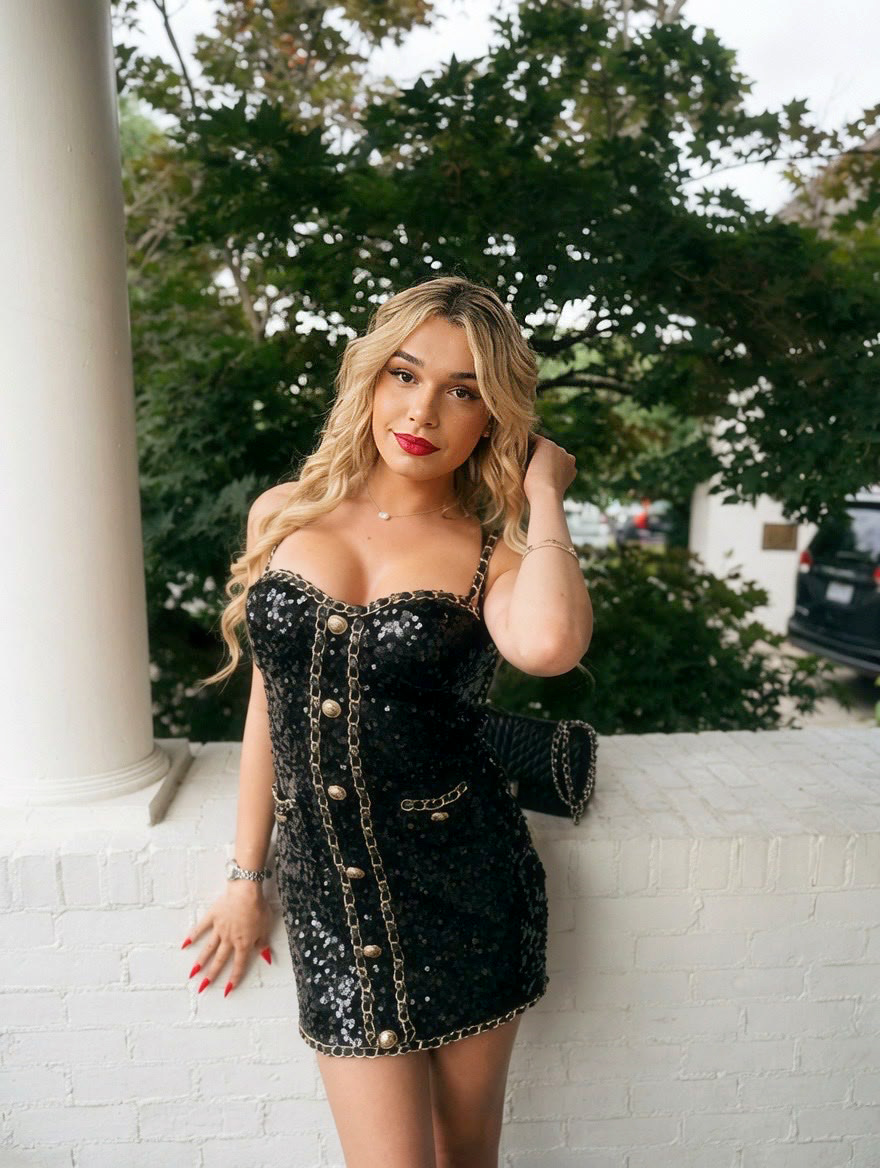 Deja in a luminous black and gold look
